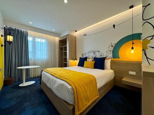 Giường trong phòng chung tại Hotel Carlton