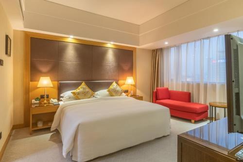 Tempat tidur dalam kamar di Aurum International Hotel Xi'an