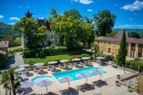 La alberca dentro o cerca de Domaine de Monrecour - Hôtel & Restaurant - Proche de Sarlat