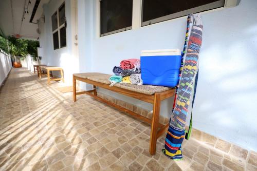 a bench against a wall with a bag on it at South Beach Family & Pet Friendly with Free Parking in Miami Beach