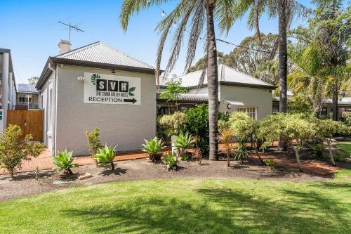 A garden outside The Swan Valley Hotel