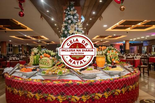 a buffet of food on a table in a restaurant at Gran Hotel Stella Maris Urban Resort & Conventions in Salvador