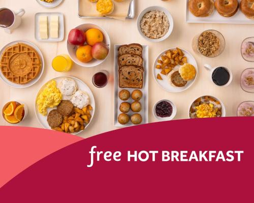 a table filled with different types of breakfast foods at Drury Inn & Suites Knoxville West in Knoxville