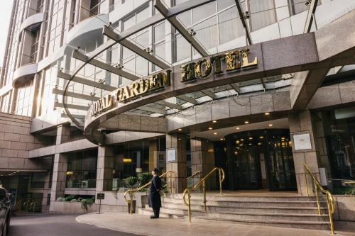 a man standing in front of a building at Royal Garden Hotel in London