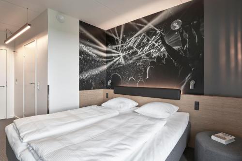 Giường trong phòng chung tại Zleep Hotel Copenhagen Arena