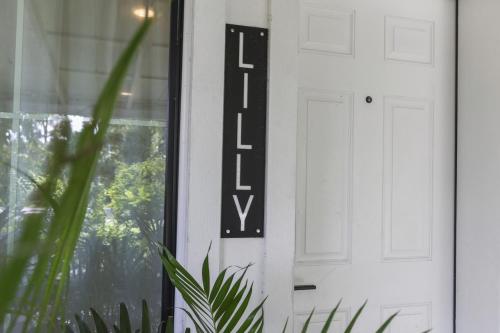 a sign on the door of a house at The Poe - Stylish Studio in downtown High Springs in High Springs