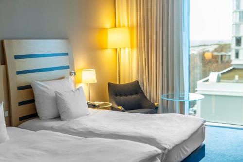 Giường trong phòng chung tại Clarion Hotel Copenhagen Airport