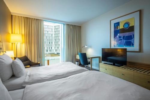 Giường trong phòng chung tại Clarion Hotel Copenhagen Airport