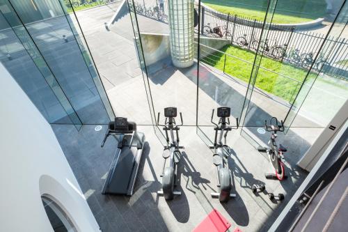 three scooters are parked in front of a building at Hotel2Stay in Amsterdam