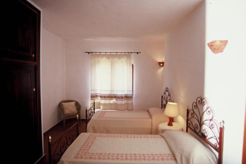 A bed or beds in a room at Le Antunne