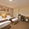 New County Hotel & Serviced Apartments by RoomsBooked