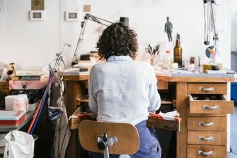 Jeweller working at workbench