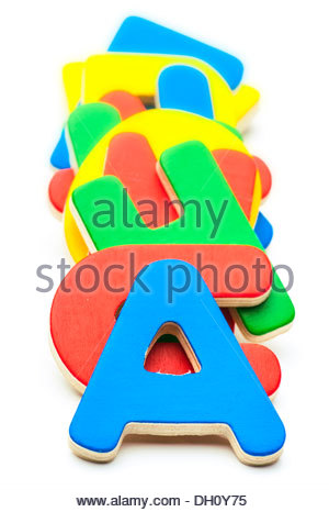 Colored Wooden Letters, Stacked One Above The Other Stock Photo.