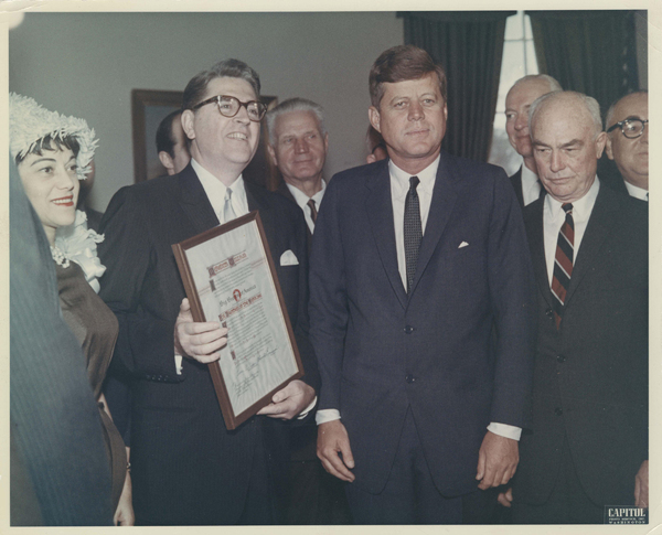 Meredith Willson and his second wife, Rini (left), receiving the Big Brother of the Y Photo
