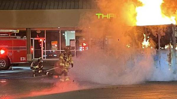 Firetruck pulls fully engulfed dumpster, saves properties in Lacey