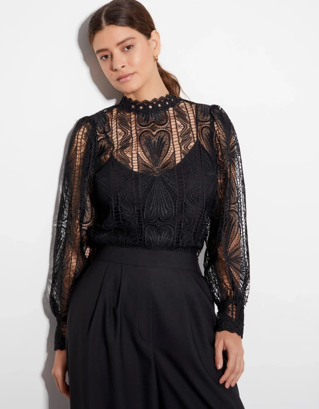 A model wears the Leona lace blouse black from Monsoon