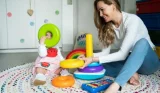 mother and child playing with kids' toys