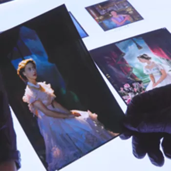 Image of hands handing photos 