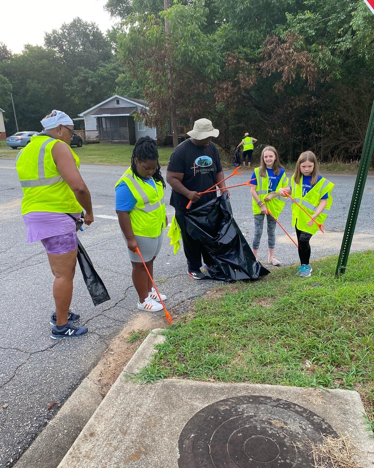 people picking up litter