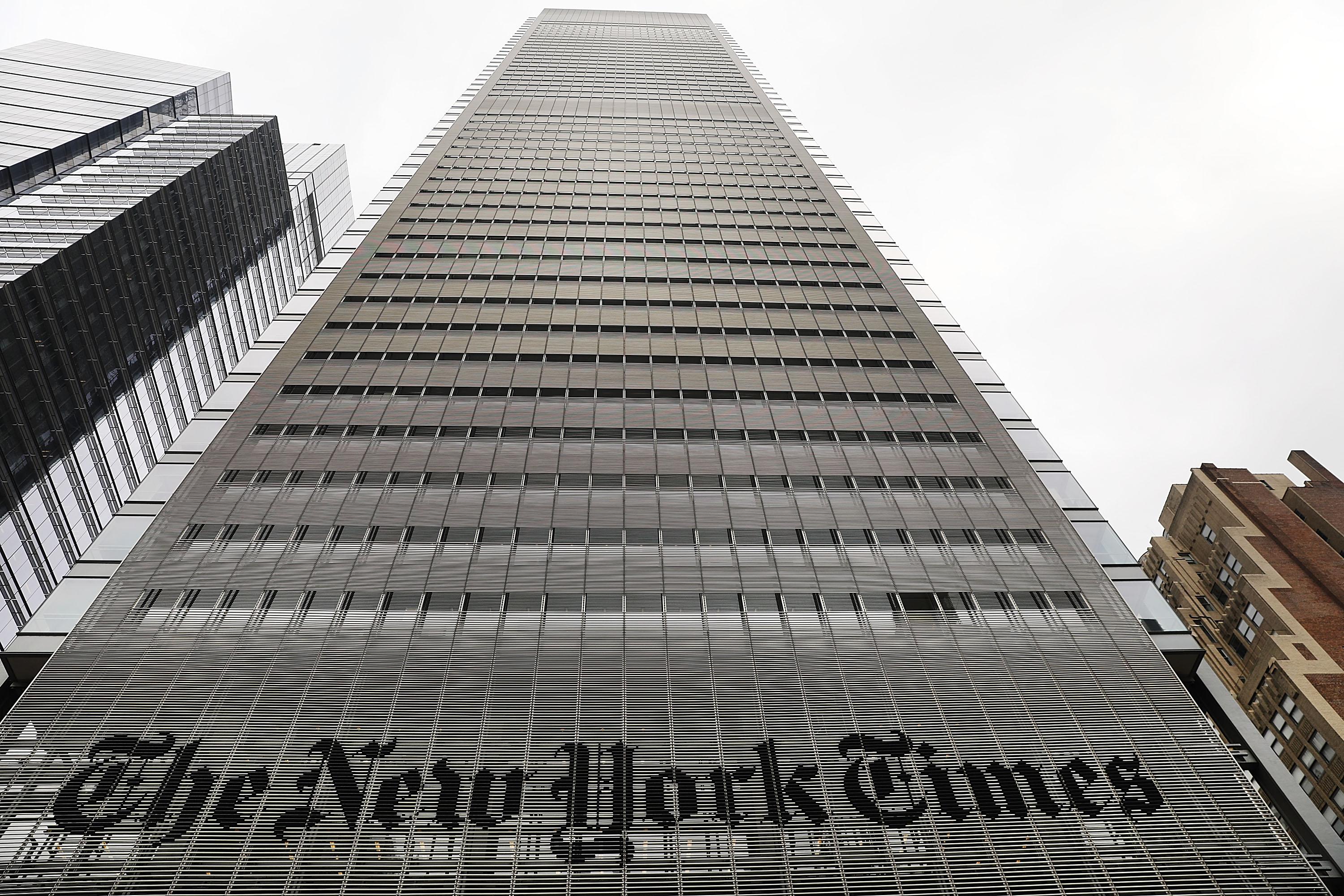 A tall building with the New York Times logo at the bottom is seen.