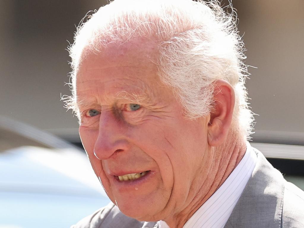 SOUTHPORT, ENGLAND - AUGUST 20: King Charles III waves to wellwishers as he departs Southport Town Hall after meeting members of the community and emergency services on August 20, 2024 in Southport, England. His Majesty met with those affected by the 29th July attack and riots alongside thanking frontline emergency staff for their ongoing work. (Photo by Jan Kruger/Getty Images)