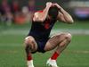 MELBOURNE, AUSTRALIA - SEPTEMBER 15: Joel Smith of the Demons is dejected after the Demons were defeated by the Blues during the AFL First Semi Final match between Melbourne Demons and Carlton Blues at Melbourne Cricket Ground, on September 15, 2023, in Melbourne, Australia. (Photo by Robert Cianflone/Getty Images)