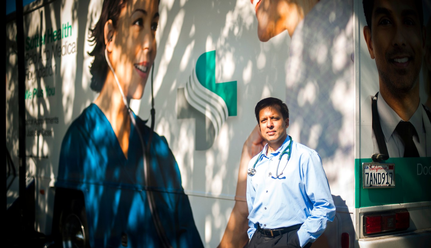Milpitas, California - October 1: Dr. Ronesh Sinha, photographed outside Sutter Health's "Care-A-Van" which travels to a variety of sillicon valley companies, providing on site exams.