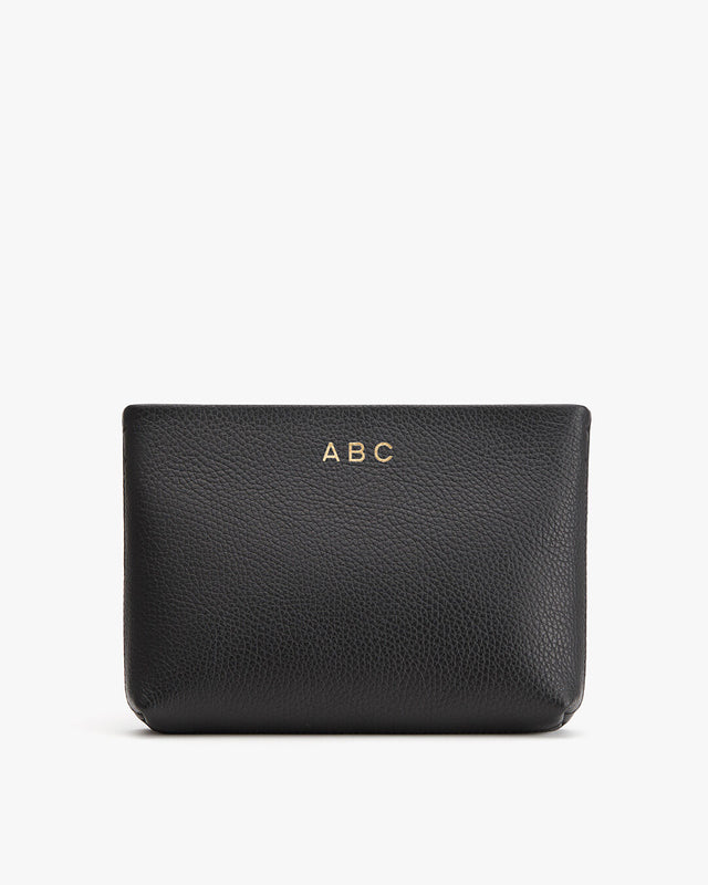 Personalized leather pouch with initials 'ABC' embossed on it.