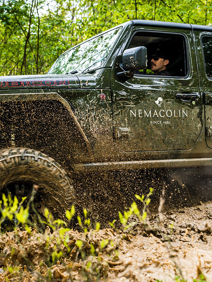 jeep driving through mud