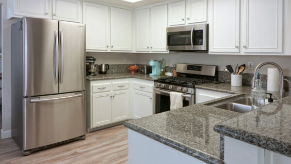 kitchen with fridge, microwave, stove and oven