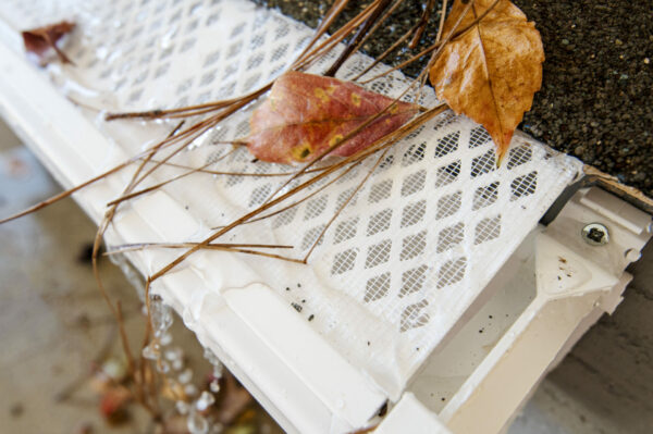 Photo of a gutter guard blocking debris