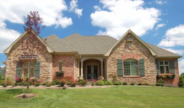 front view of single floor, large brick home