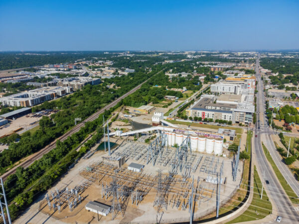 Aerial view of the electrical substation and Dallas downtown cityscape