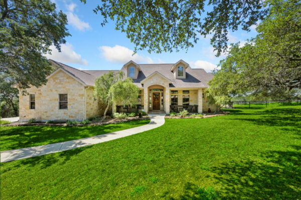 stone home with a pathway