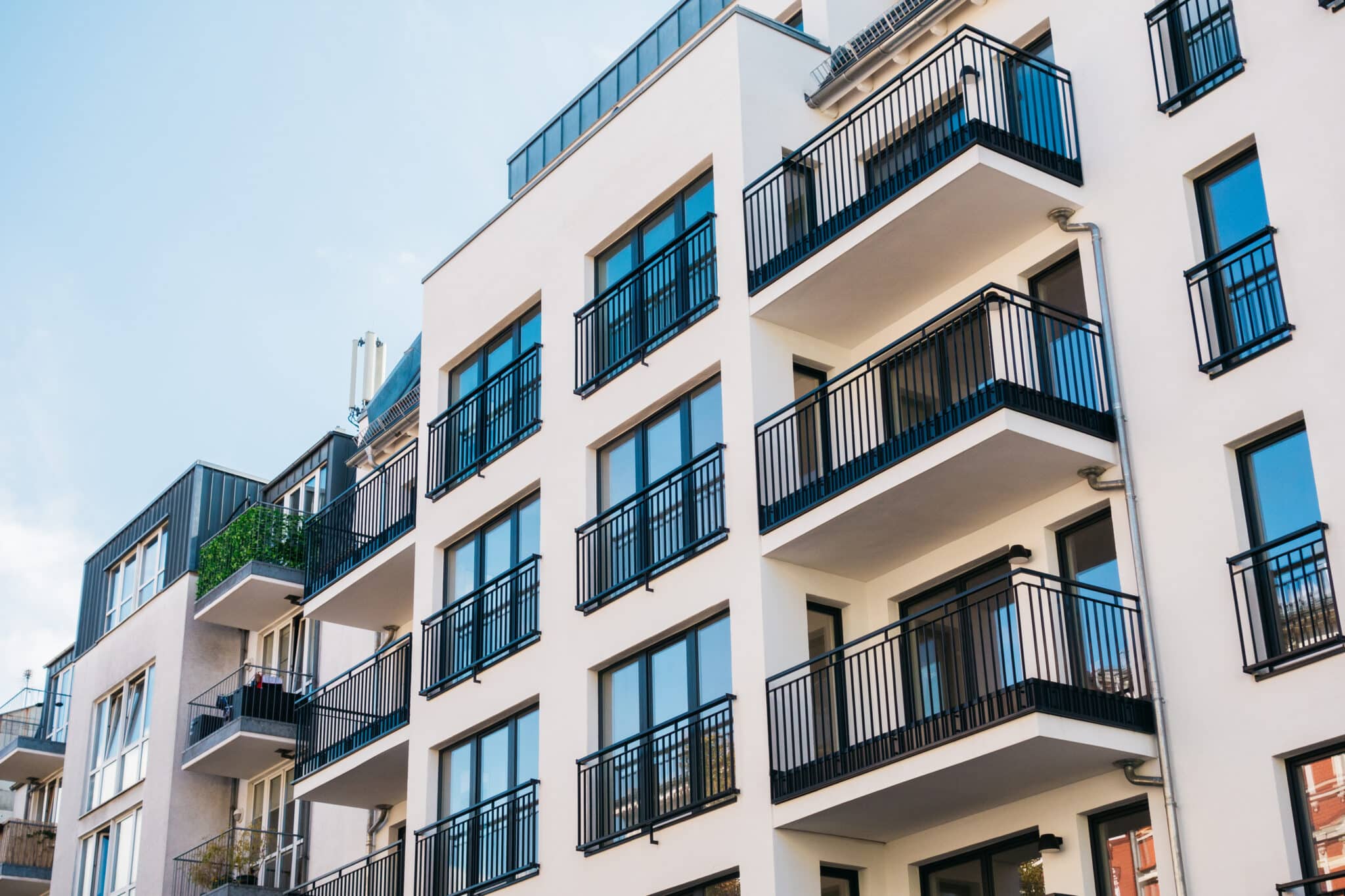 Modern apartment building with rental units requiring cheap, high-quality renters insurance coverage