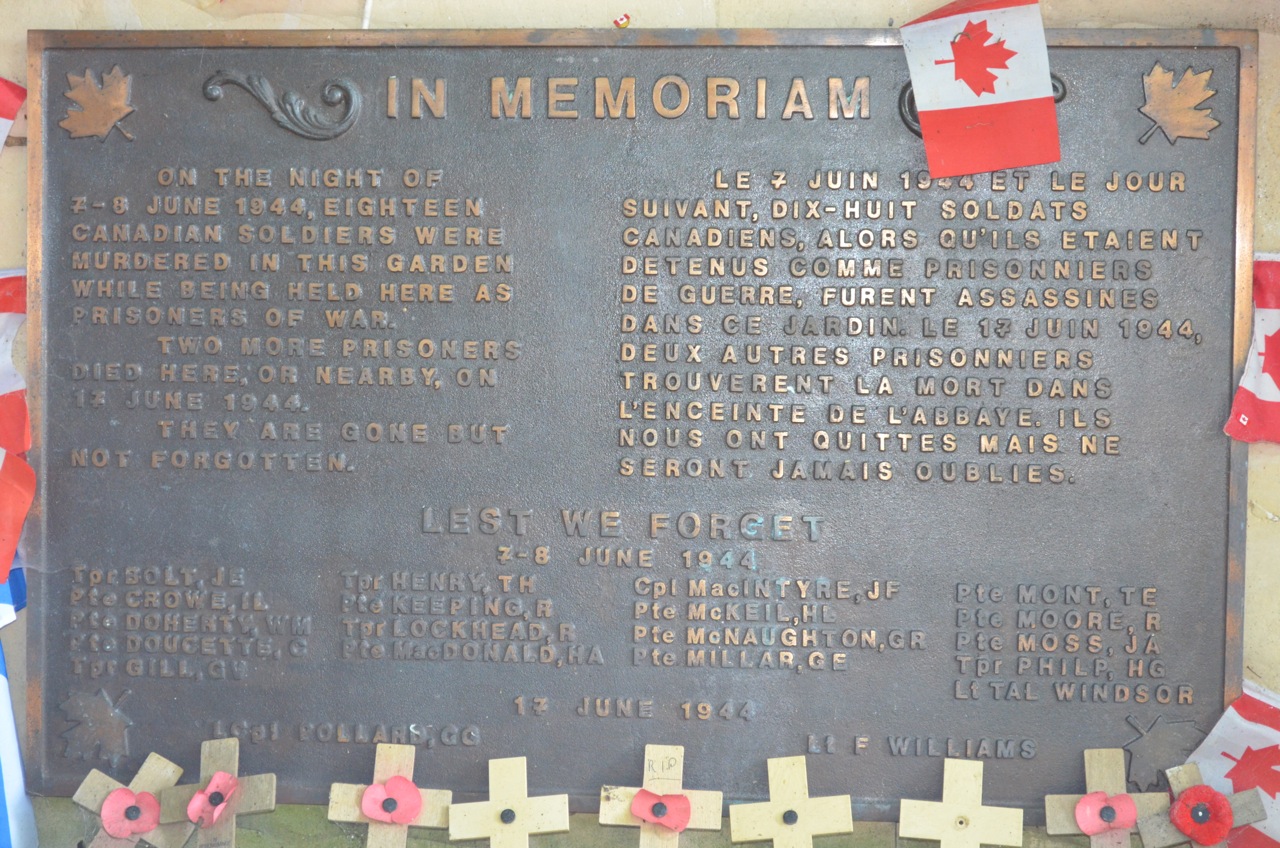 A plaque in the garden at the Abbaye Ardenne, commemorating the massacre of Canadian prisoners in early June 1944.