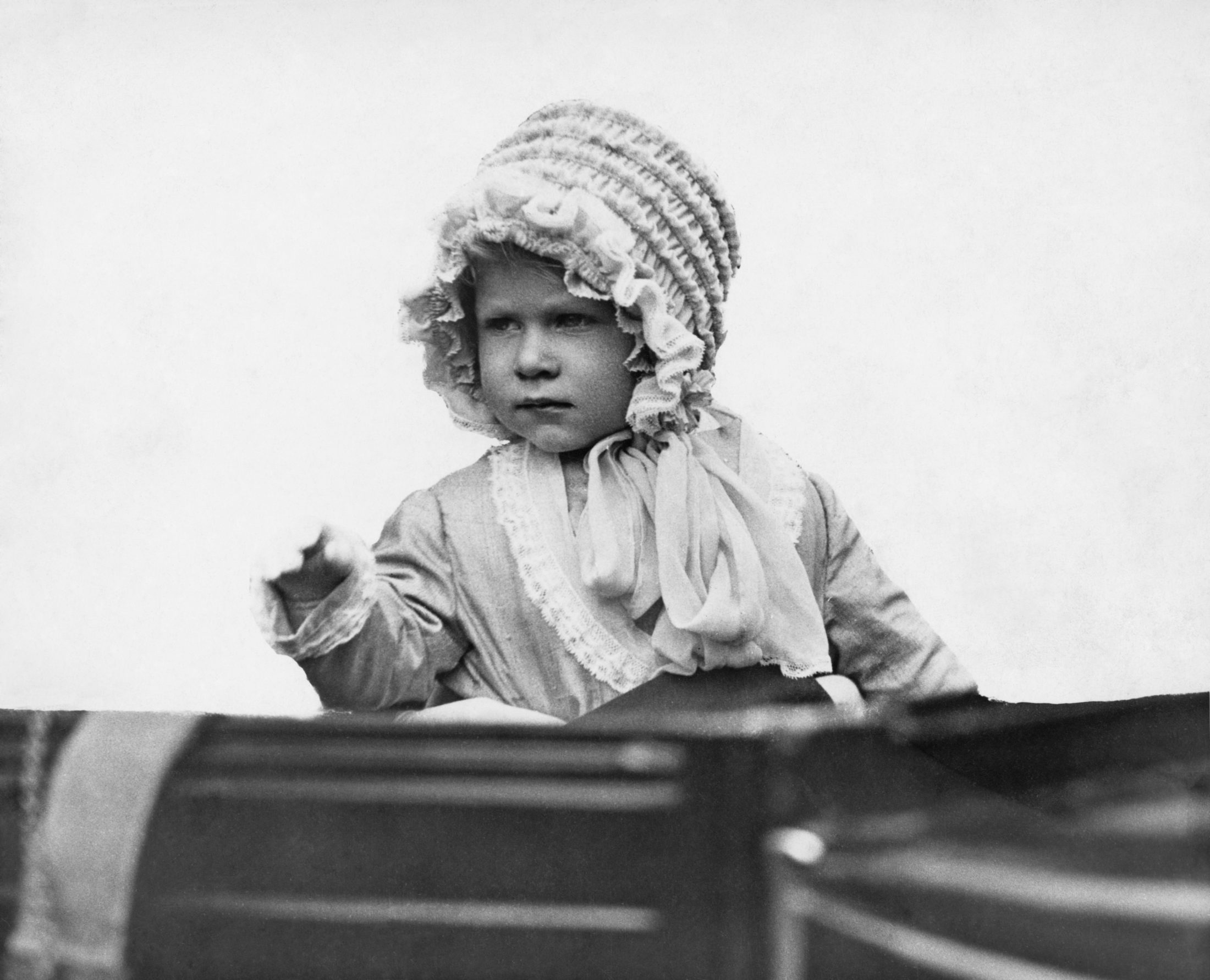 The young Princess Elizabeth, seen here in 1928, already demonstrates a fancy for elaborate hats. Photo by Central Press/Hulton Archive/Getty Images