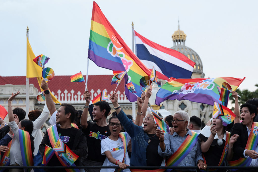 Members of the LGBTQ+ community celebrate after the passing of the marriage equality bill in its second and third readings...