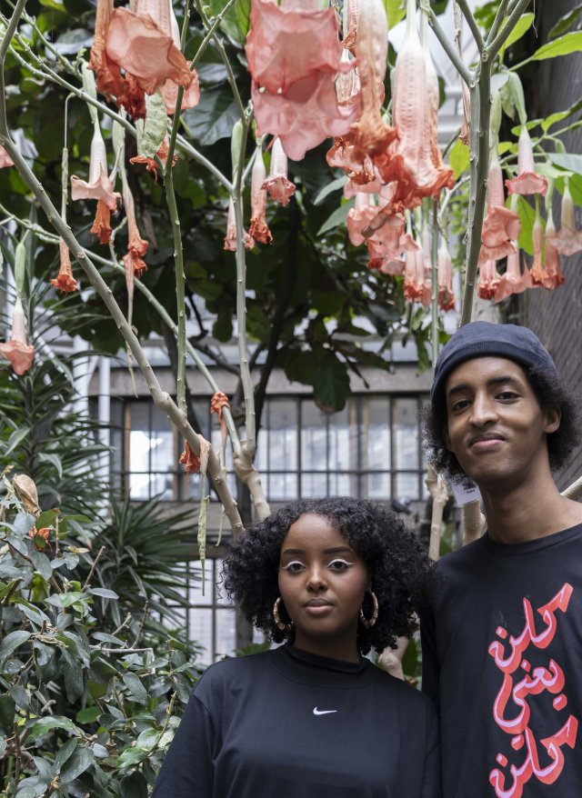 Two people stand in the garden room in the Barbican Centre