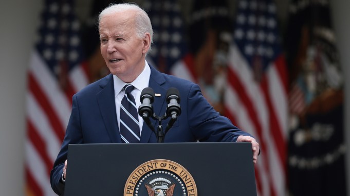 President Joe Biden speaks at a podium.