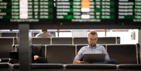 Team member working remotely at an airport