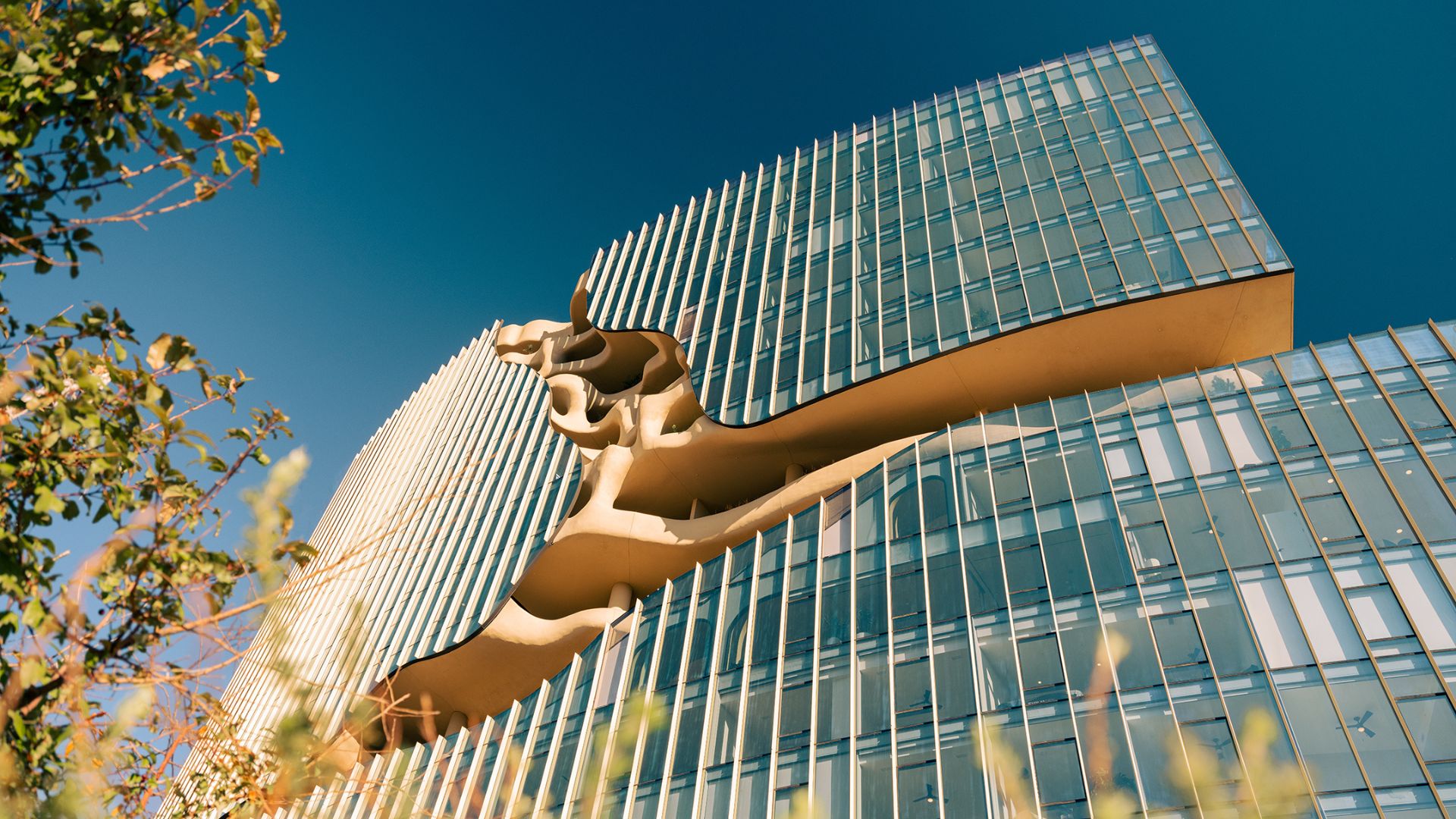 MAD Architects’ One River North apartment block in Denver, Colorado stands tall with its stunning, cracked-open facade.