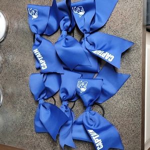 Cheer bows, royal blue ribbon, 3" thick, approximately 8" wide after tied.