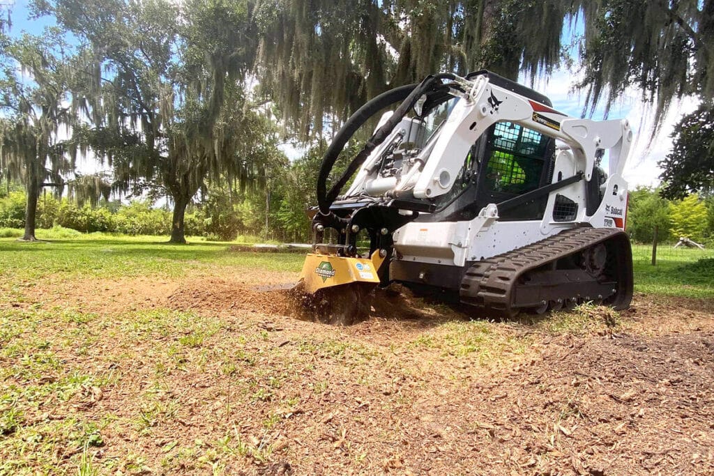 skid steer with reflex stump grinder