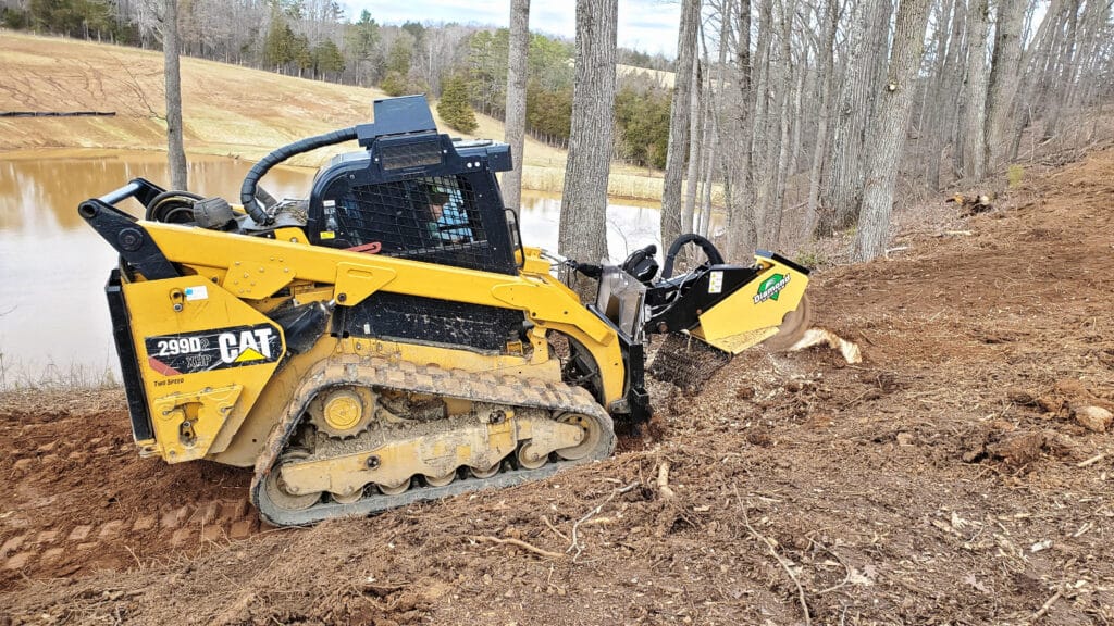 skid steer with Miller Stump Grinder