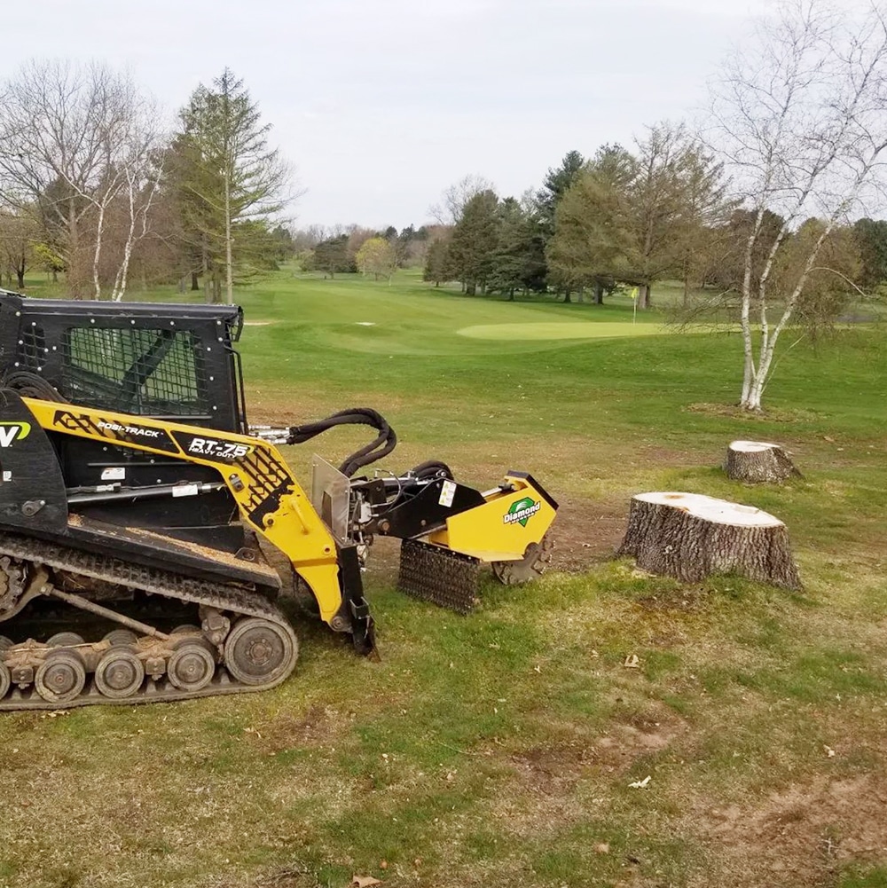 skid steer with Miller Stump Grinder