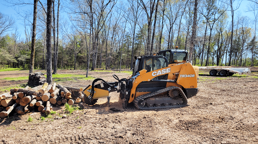 skid steer with Miller Stump Grinder