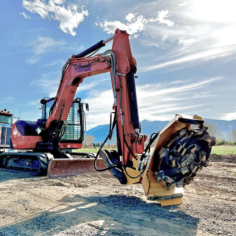 excavator with a disc mulcher