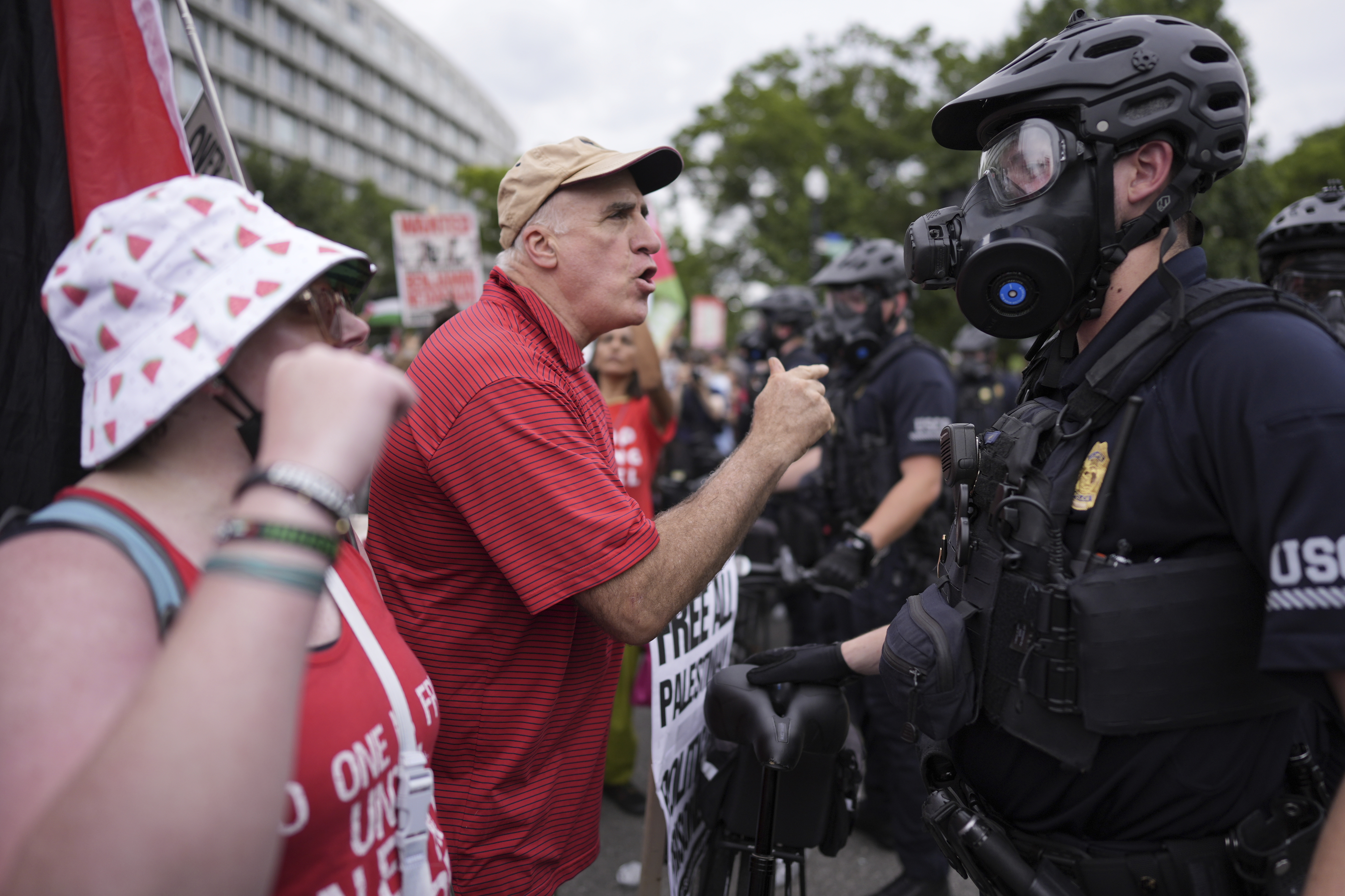 United States Capitol Police stand near protestors, Wednesday, July 24, 2024, in Washington, during of a scheduled visit by Israeli Prime Minister Benjamin Netanyahu at the U.S. Capitol. (AP Photo/Mike Stewart)