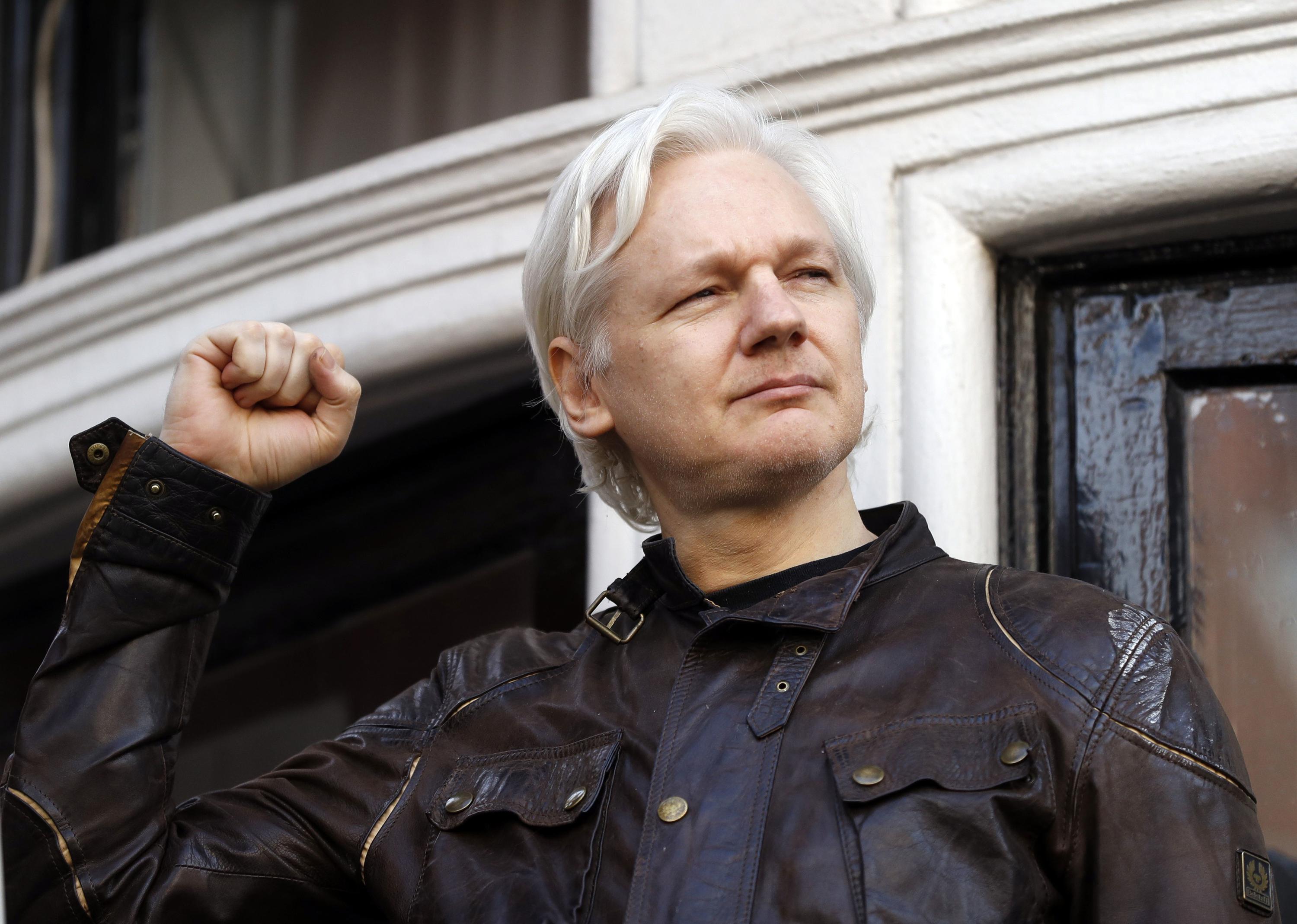 FILE - Julian Assange greets supporters outside the Ecuadorian embassy in London, on May 19, 2017. Australia’s Prime Minister Anthony Albanese said Wednesday, Nov. 30, 2022, he recently told U.S. President Joe Biden’s administration to bring WikiLeaks founder and Australian citizen Julian Assange’s prosecution to a close.(AP Photo/Frank Augstein, File)